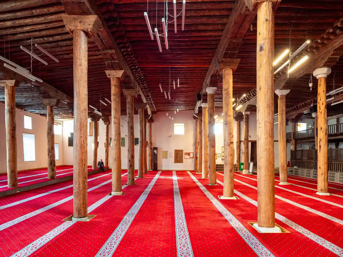 A traditional mosque interior with wooden columns