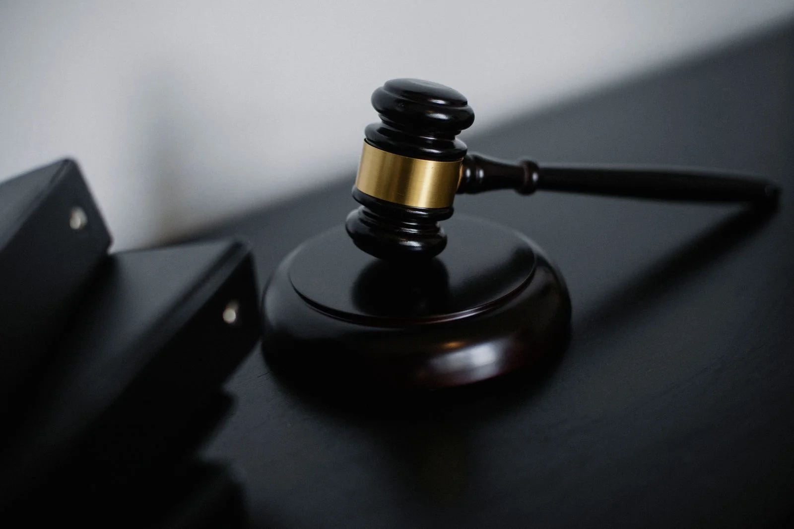 Judge's gavel and law book on desk